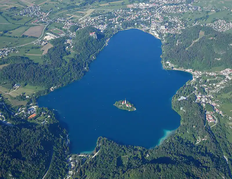 Blue lake with a tiny island seen from above