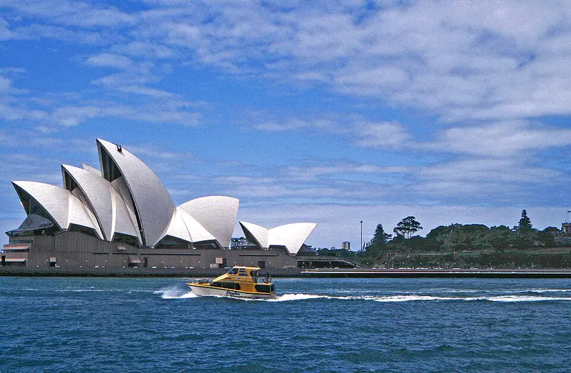 White sail-shaped roofs of an opera house on a harbor