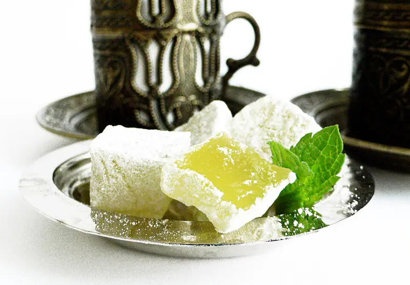 Cubes of Turkish delight with mint on a silver dish