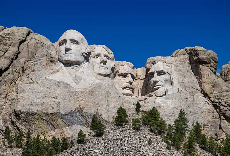 Mount Rushmore carved faces in a granite cliff